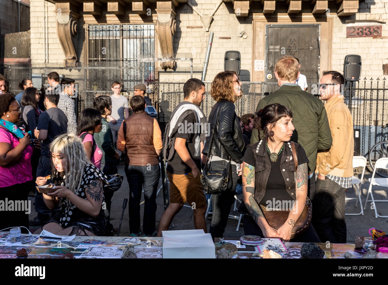 OAKLAND, CALIFORNIA-June 6, 2014:The people scene at the Oakland Art Murmur First Friday street festival on Telegraph Avenue in the Uptown district. Stock Photo