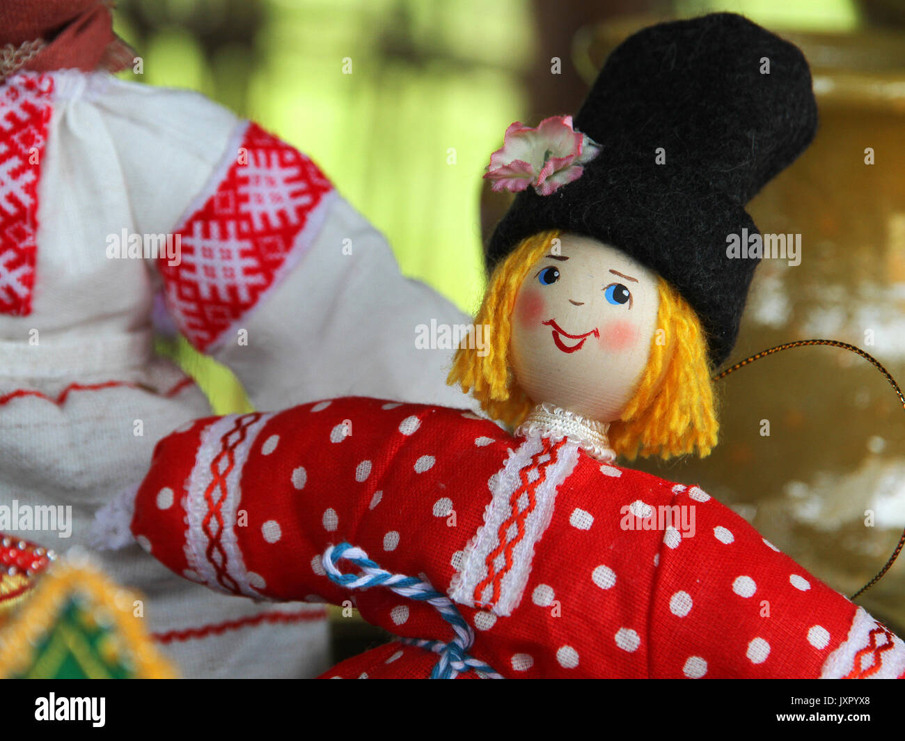 Desk at the flea market: handmade rag doll man, in traditional ethnic russian costume Stock Photo