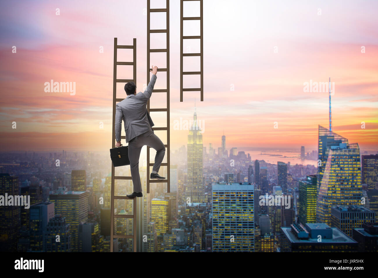 Businessman climbing career ladder in business concept Stock Photo - Alamy