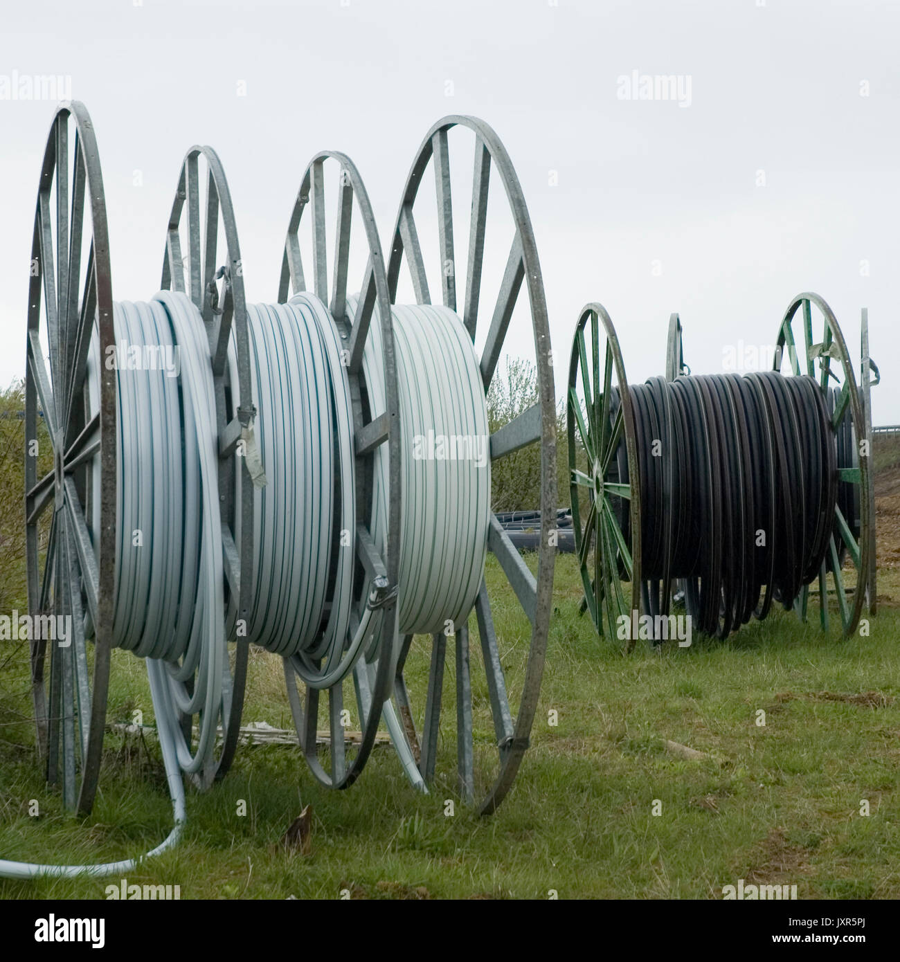 plastic hoses on reels Stock Photo Alamy