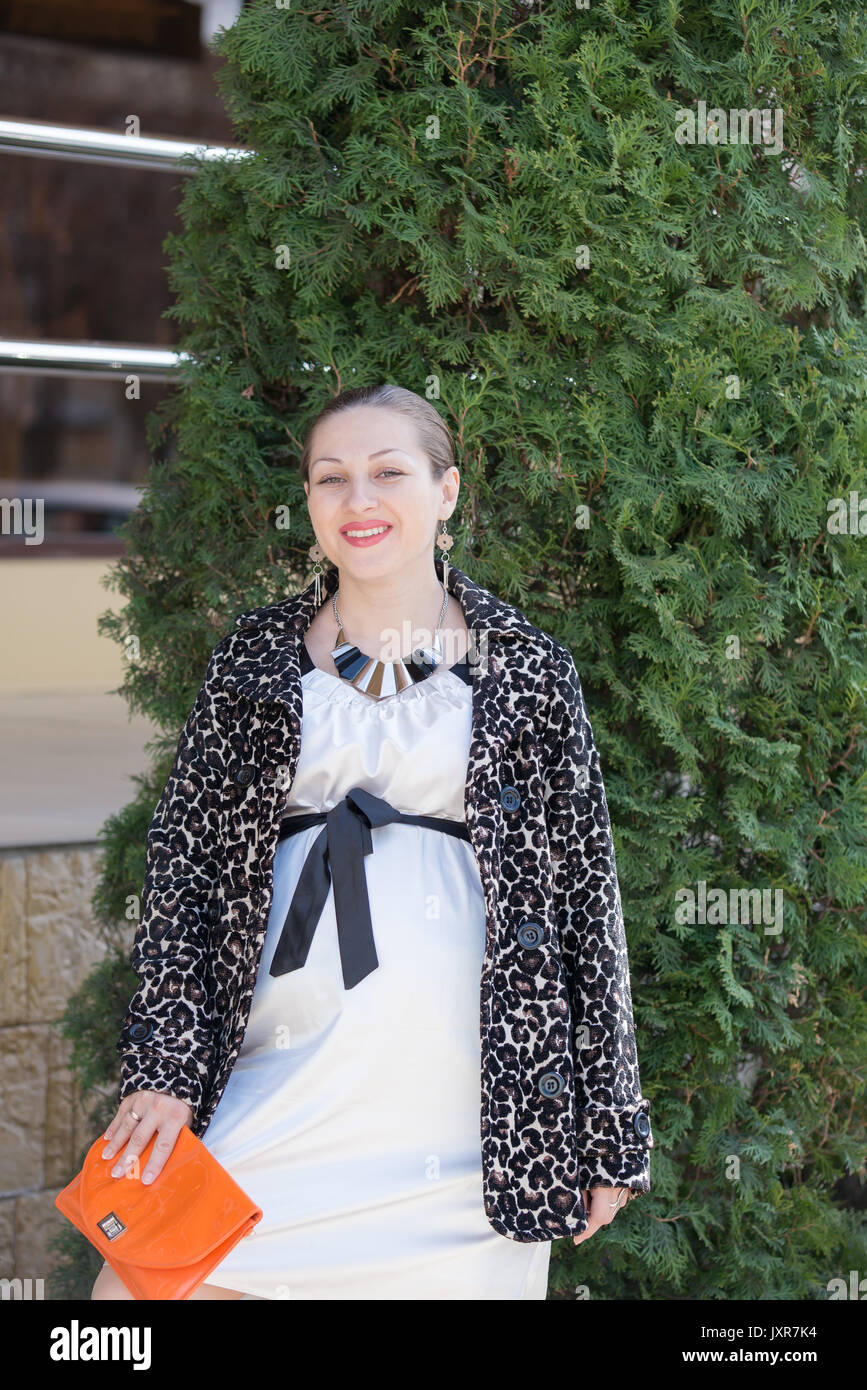 The pregnant girl on walk in city park Stock Photo - Alamy