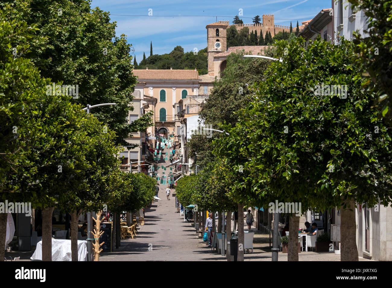 View through the main street Carrer de Ciutat towards Santuari de Sant Salvador in Arta city Stock Photo