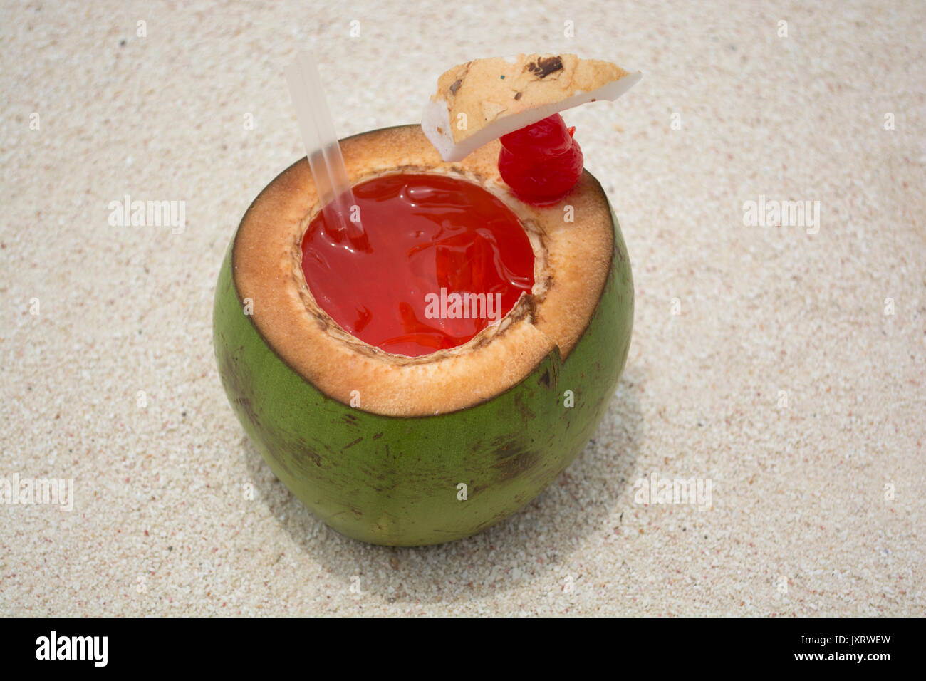 Tropical Coconut Cocktail on the sand. Stock Photo