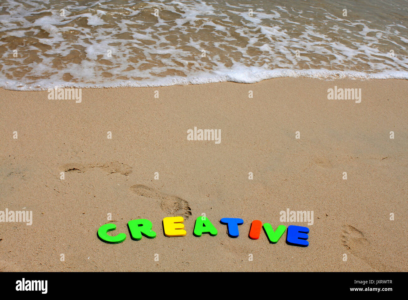 Creative text written with plastics letters colours. Stock Photo