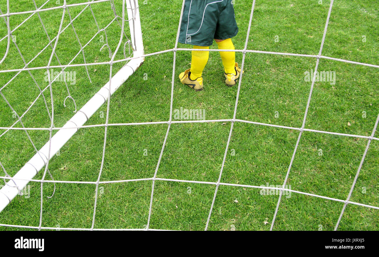 soccer goalkeeper from behind the net Stock Photo