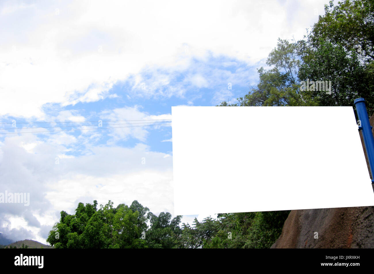 Blank white sign against deep blue sky whit mountains Stock Photo - Alamy