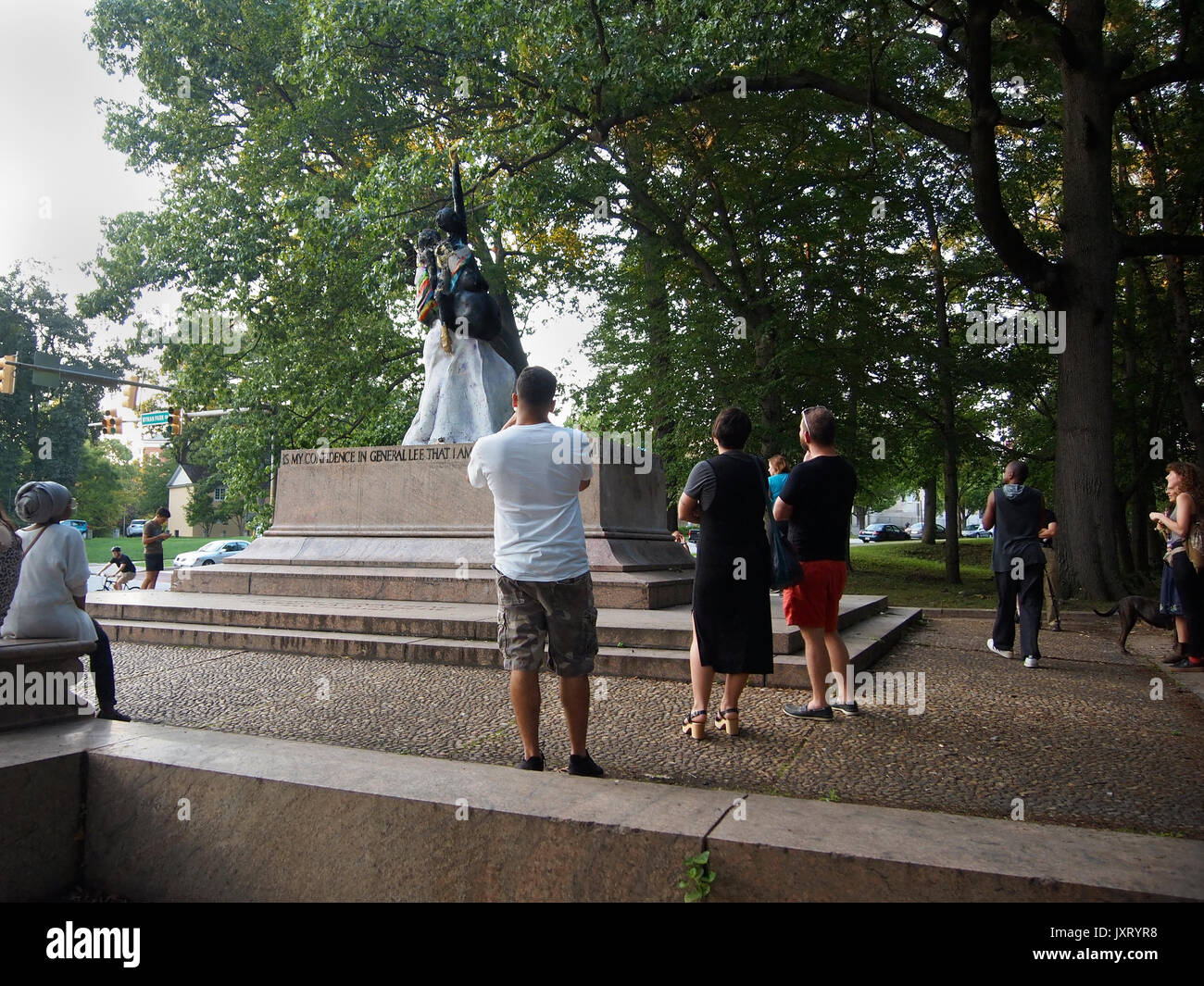 Baltimore, Maryland, USA. 16th Aug, 2017. A crowd gathers around the site where a confederate statue of Robert E. Lee and Stonewall Jackson was removed during the night by city officials. A statue by local artist Pablo Machiolo suddenly stands in it's place. Credit: Cheryl Moulton/Alamy Live News Stock Photo