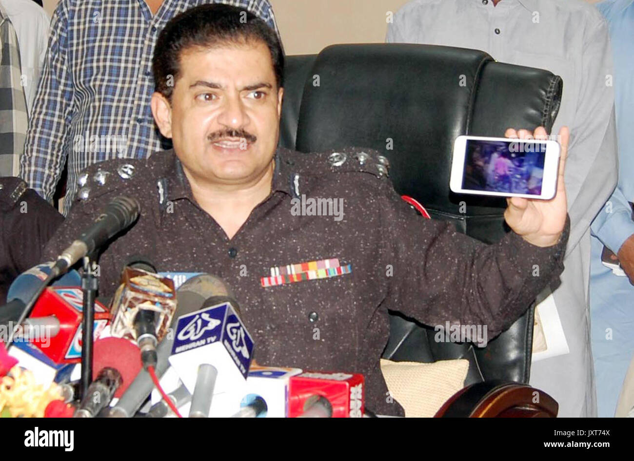 DIG Police CIA, Dr. Jameel Ahmed gives briefing to media persons during a press conference about detention of criminals associated with defunct Lashkar- e-Jhangvi alleged in robberies, murders and extortion, at his office in Karachi on Thursday, August 17, 2017. Stock Photo
