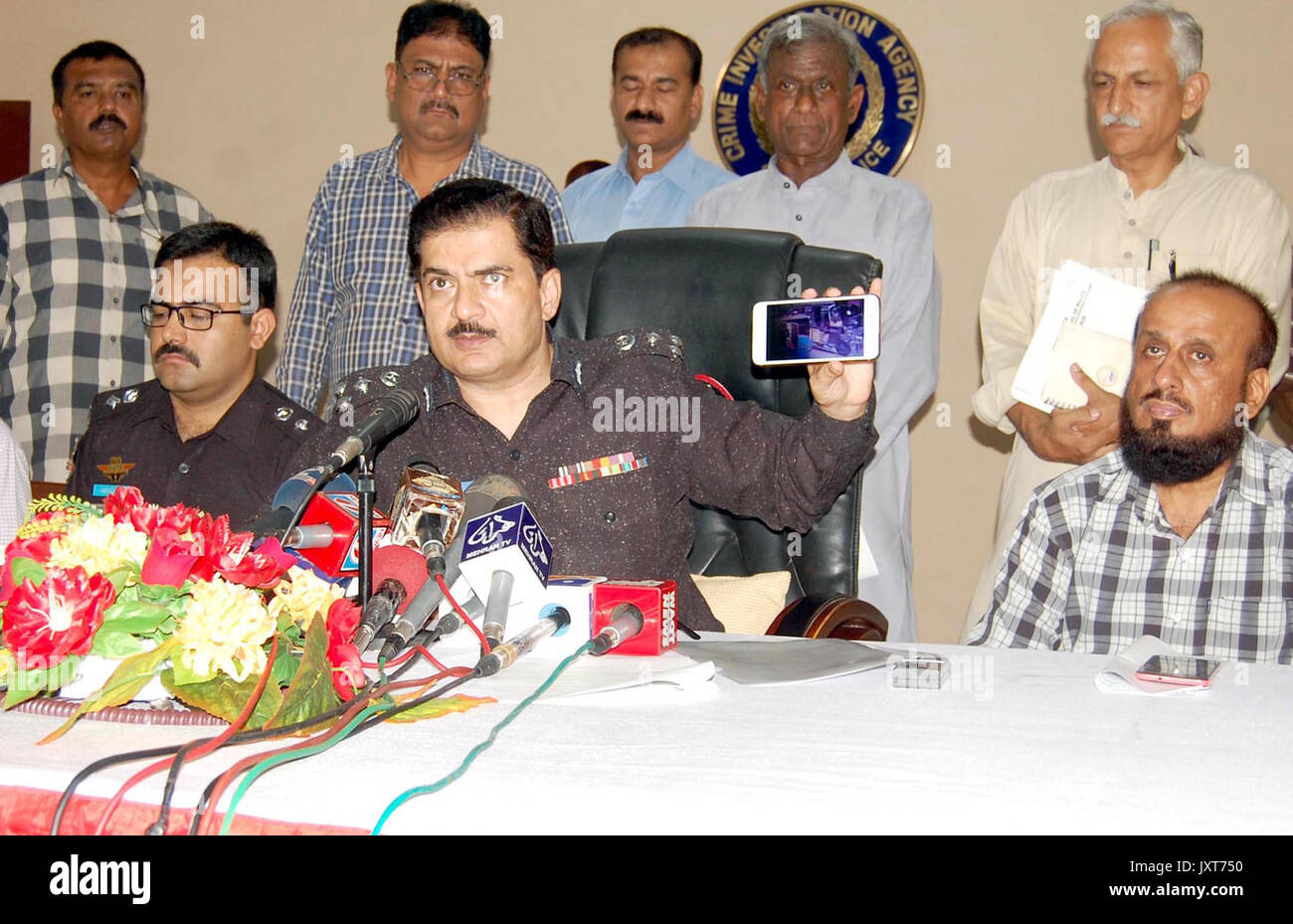 DIG Police CIA, Dr. Jameel Ahmed gives briefing to media persons during a press conference about detention of criminals associated with defunct Lashkar- e-Jhangvi alleged in robberies, murders and extortion, at his office in Karachi on Thursday, August 17, 2017. Stock Photo