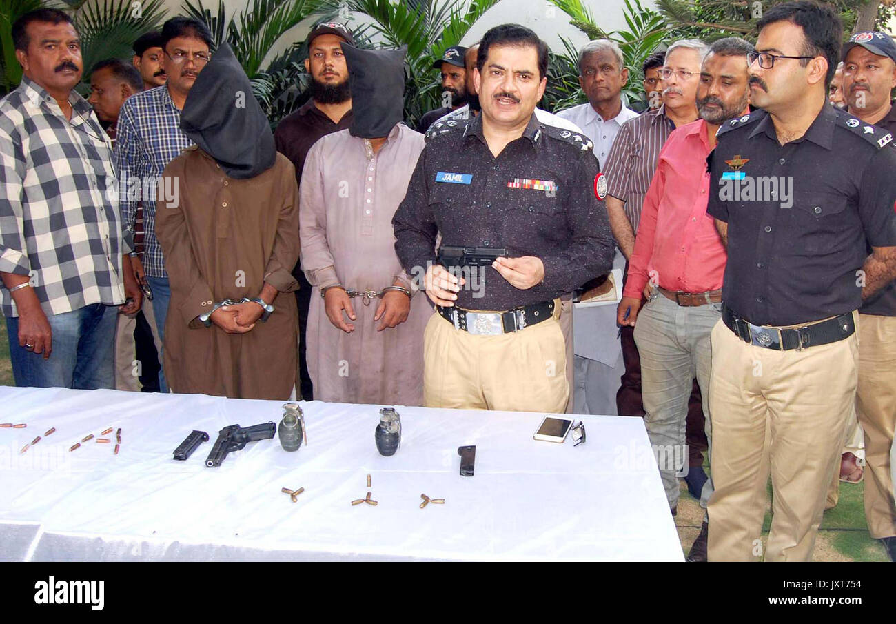 DIG Police CIA, Dr. Jameel Ahmed gives briefing to media persons during a press conference about detention of criminals associated with defunct Lashkar- e-Jhangvi alleged in robberies, murders and extortion, at his office in Karachi on Thursday, August 17, 2017. Stock Photo