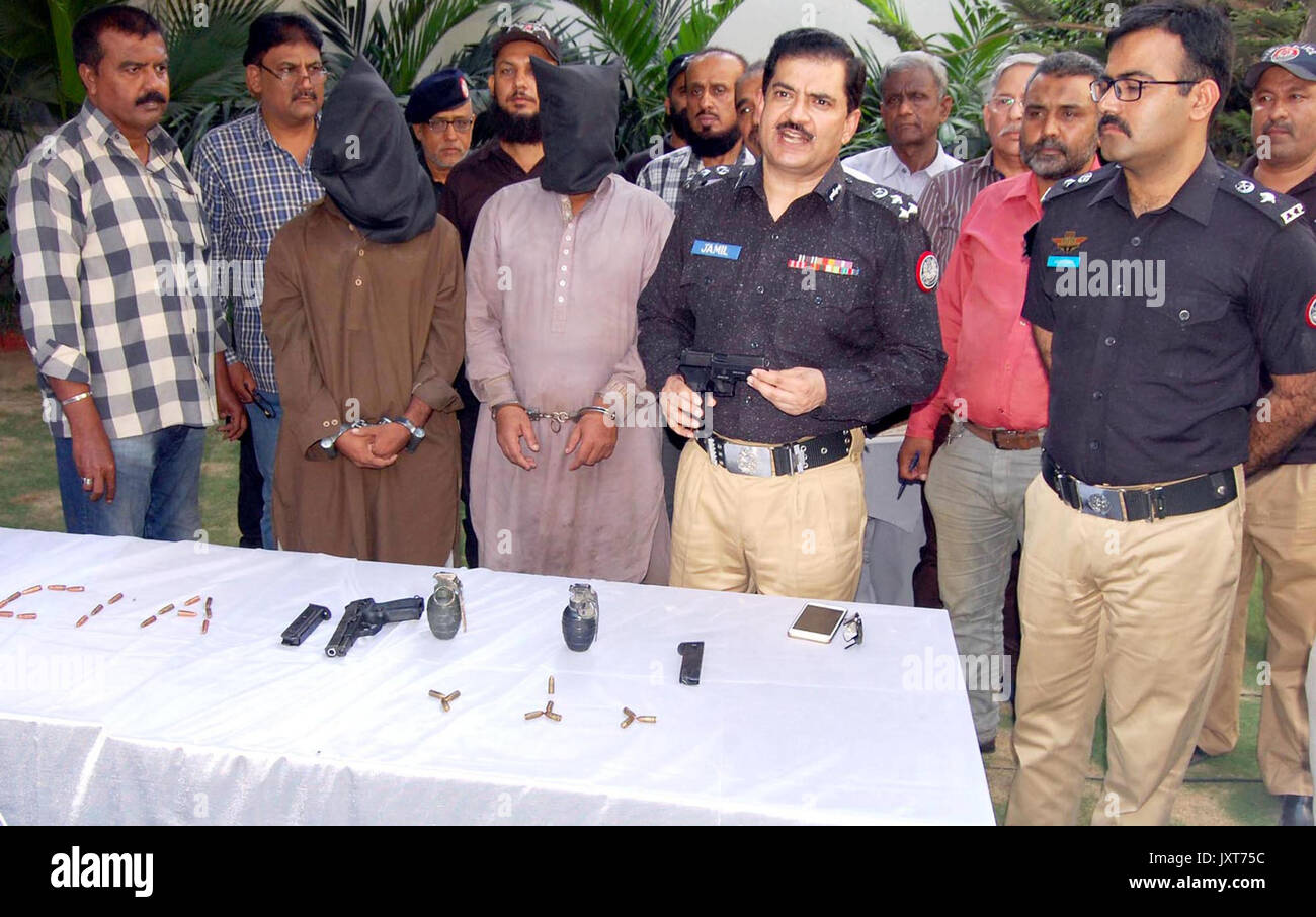 DIG Police CIA, Dr. Jameel Ahmed gives briefing to media persons during a press conference about detention of criminals associated with defunct Lashkar- e-Jhangvi alleged in robberies, murders and extortion, at his office in Karachi on Thursday, August 17, 2017. Stock Photo