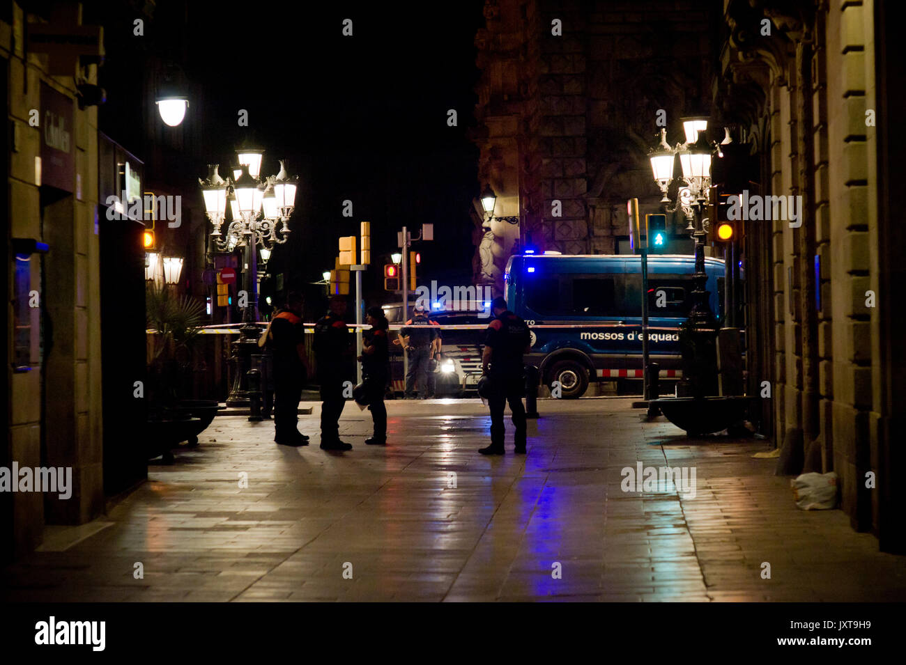 Barcelona, Spain. 17th Aug, 2017. Police officers patrol Las Ramblas area of Barcelona where there has been a terrorist attack. Thirteen people are dead and at least 50 injured after a van rammed into the crowd of Las Ramblas  street in Barcelona. Credit:  Jordi Boixareu/Alamy Live News Stock Photo