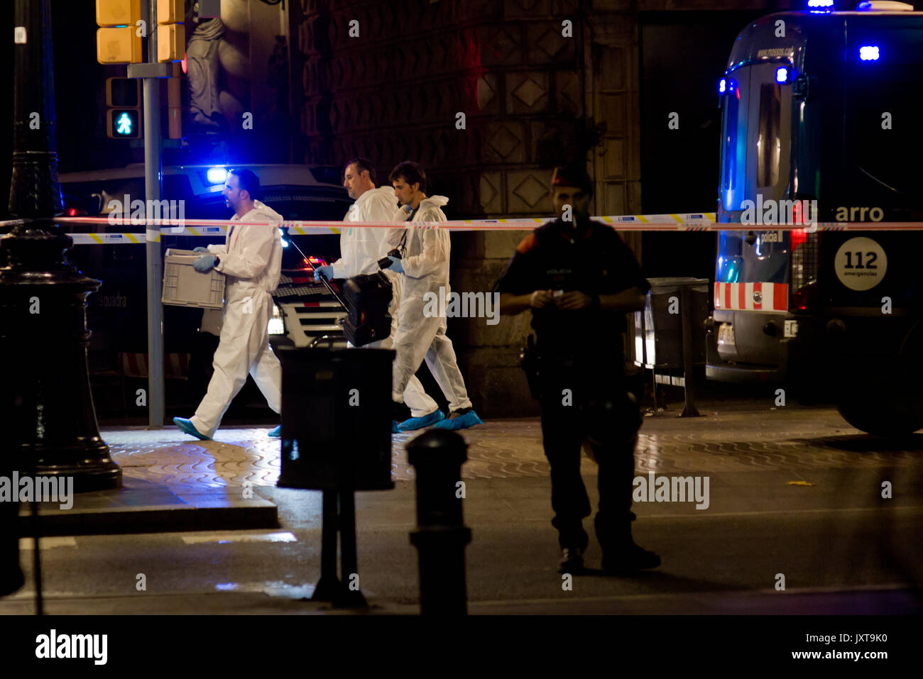 Barcelona, Catalonia, Spain. 17th Aug, 2017. Members of the scientific police walk by Las Ramblas area of Barcelona where there has been a terrorist attack. Thirteen people are dead and at least 50 injured after a van rammed into the crowd of Las Ramblas street in Barcelona. Credit: Jordi Boixareu/ZUMA Wire/Alamy Live News Stock Photo