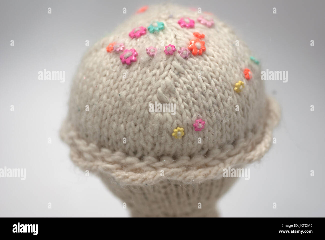 Close up of a Hand Knit Vanilla Ice Cream Cone Stock Photo