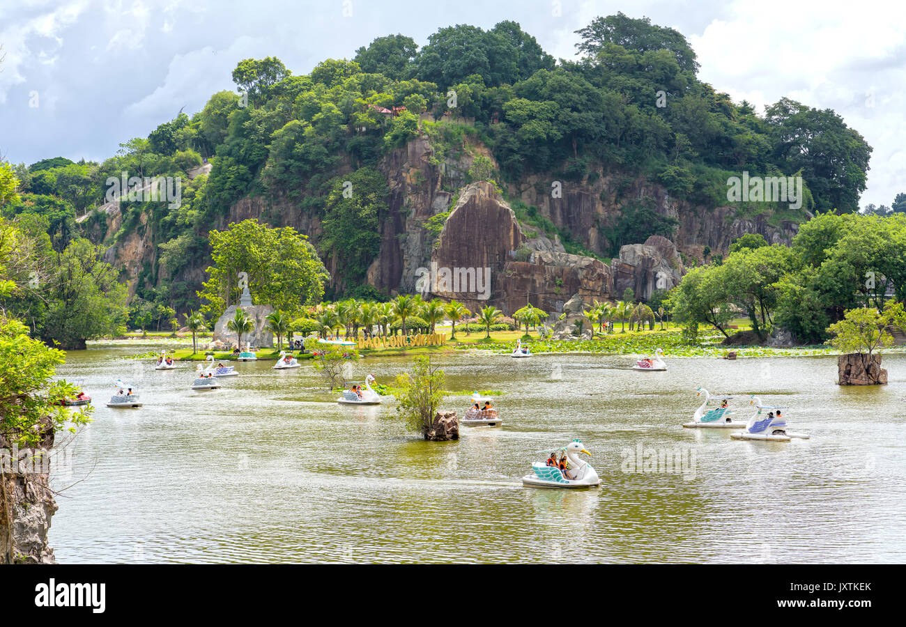 Dong Nai, Vietnam - June 4th, 2017: The lovers relaxing on a swan boat on lake on sunny spring morning, boat trip on the lake floating distance romant Stock Photo