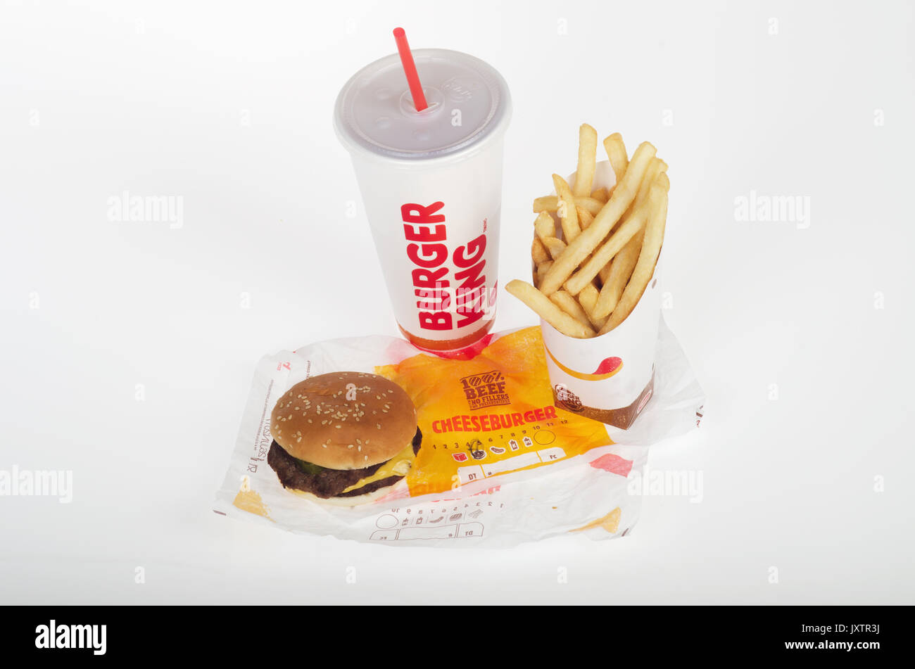 Burger King double cheeseburger with large french fries and drink with straw on wrapper. USA Stock Photo