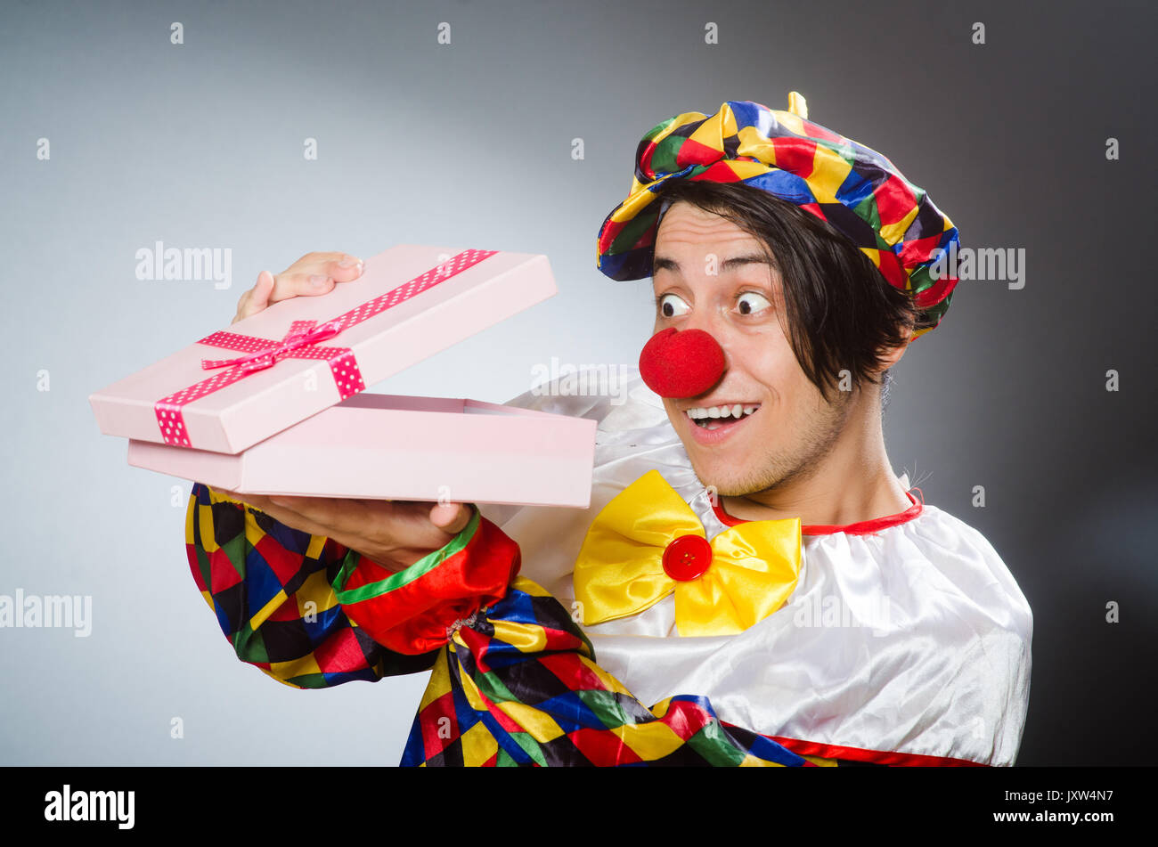 Funny clown in comical concept Stock Photo - Alamy