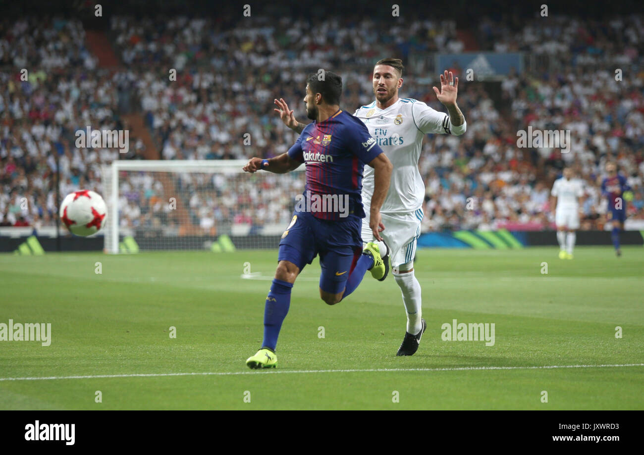 Luis Suarez and Sergio Ramos. Real Madrid defeated Barcelona 2-0 in the second leg of the Spanish Supercup football match at the Santiago Bernabeu sta Stock Photo