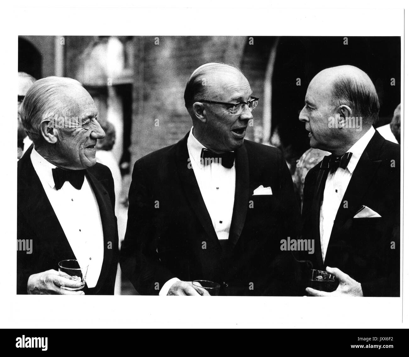 Associates, Detlev Wulf Bronk, Milton Stover Eisenhower, Dinner at Evergreen House, Detlev Bronk and Milton Eisenhower talking to unidentified man, 1971. Stock Photo