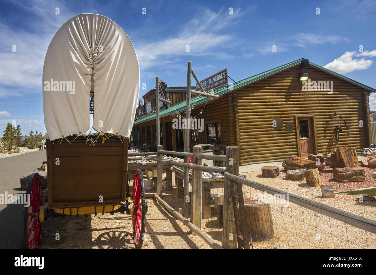 Old wagon wheel carriage stage coach and souvenir rock shop in replica