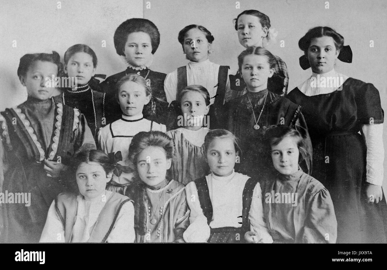 Half length portrait of young girls, African American girl on the left, neutral facial expressions, 1915. Stock Photo