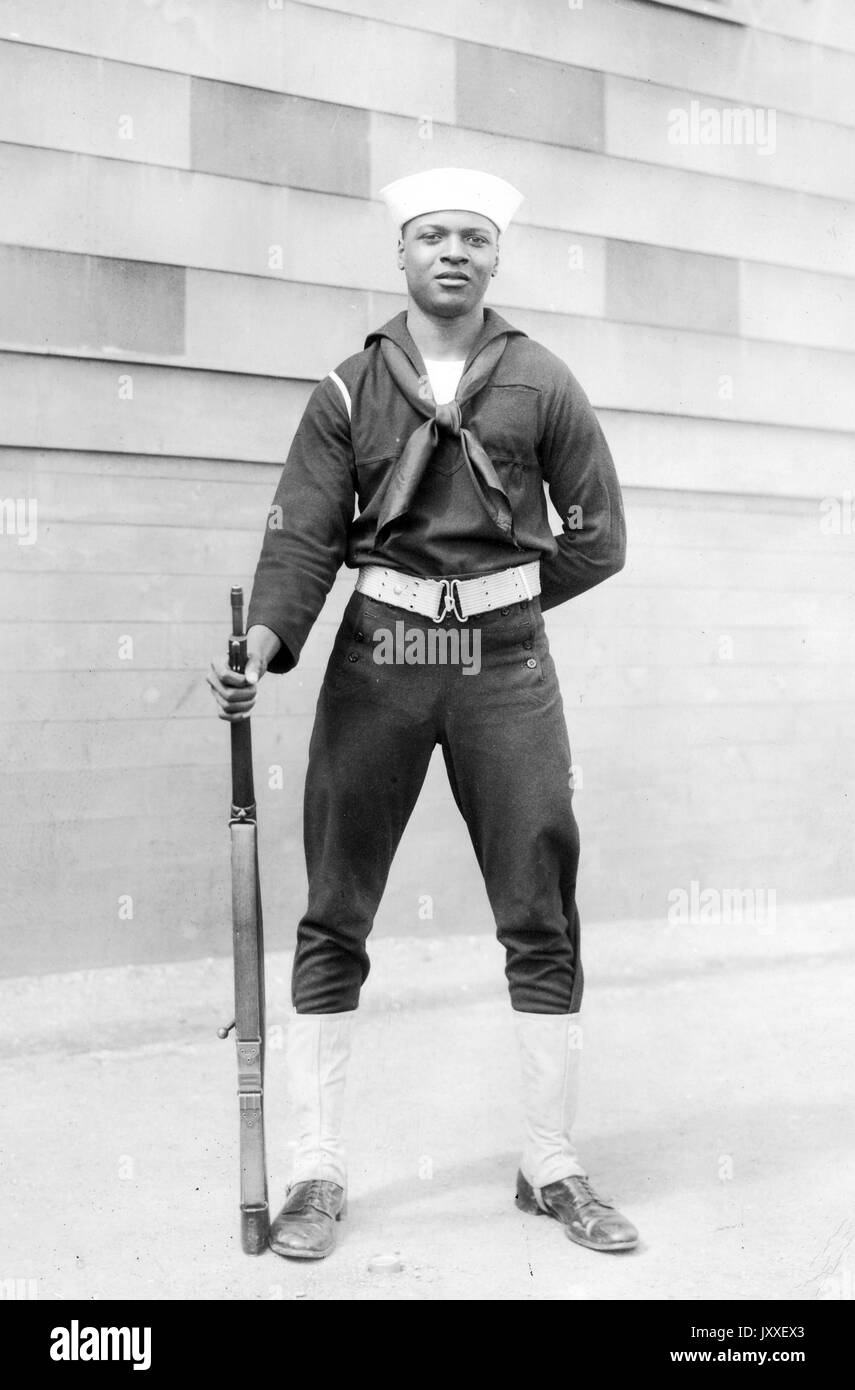 portrait-of-an-african-american-us-navy-sailor-standing-in-front-of-JXXEX3.jpg