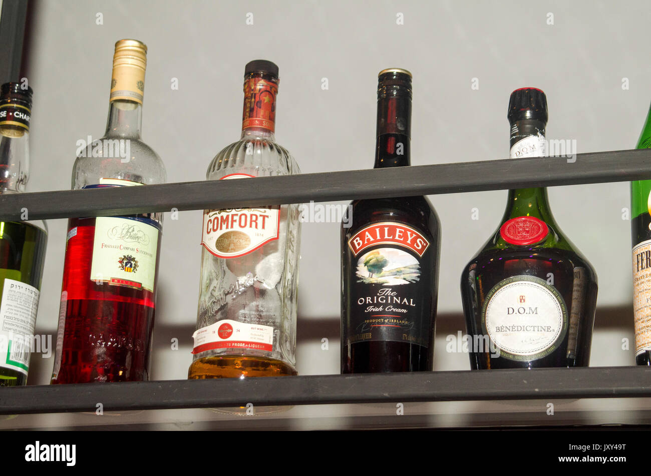 various bottles of alcohol on display in a bar Stock Photo