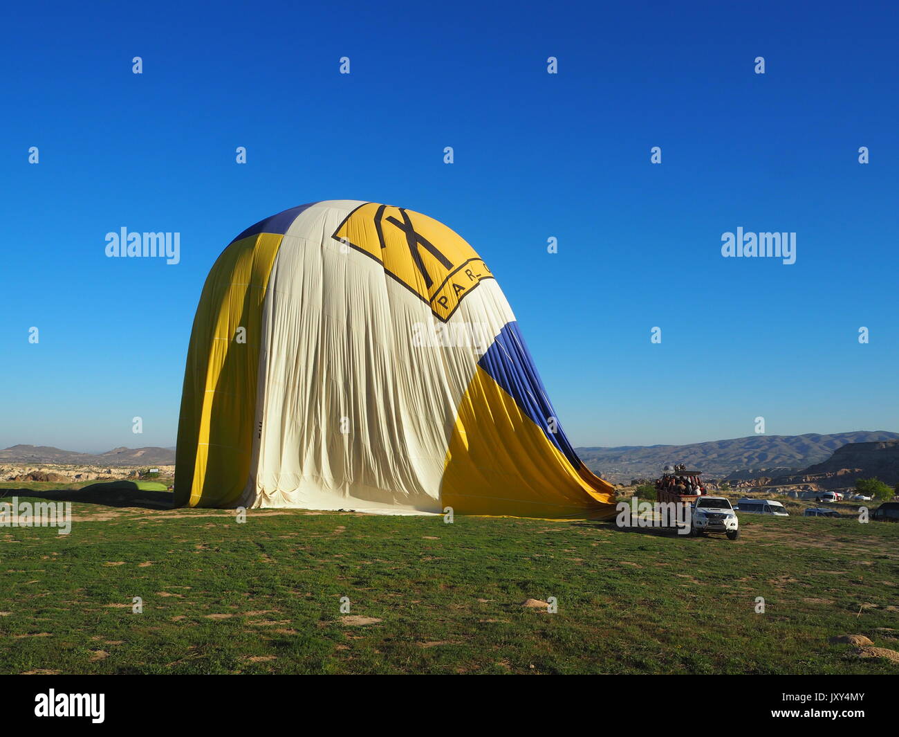 Hot air balloon landed safely on ground Stock Photo
