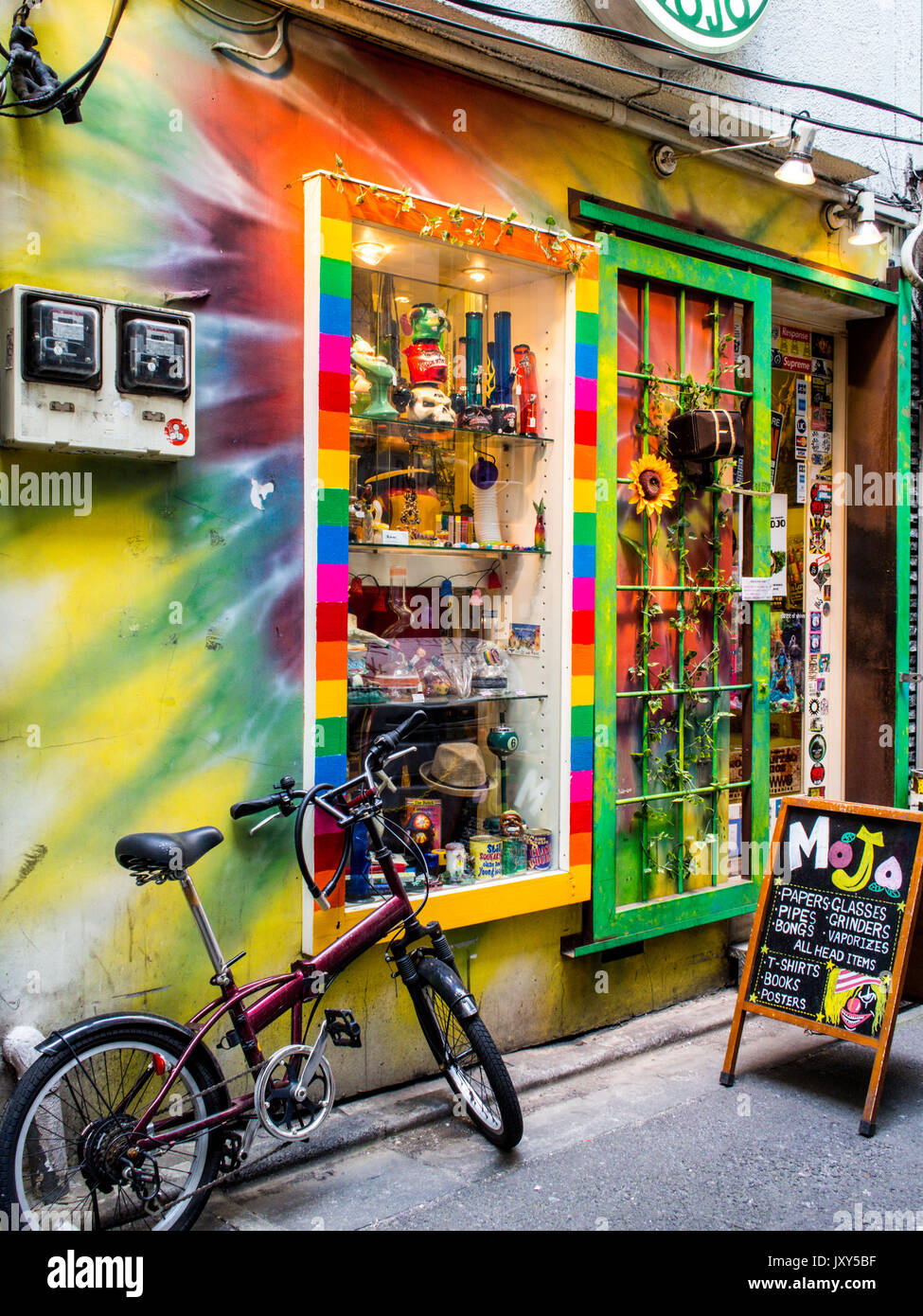 Head shop Mojo, selling  cannabis related products with bicycle and sunflower, , Shibuya, Tokyo, Japan Stock Photo