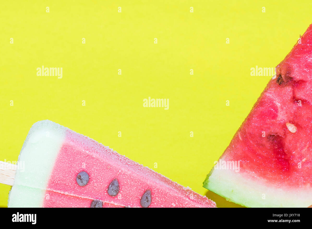Watermelon slice and ice cream on yellow background Stock Photo