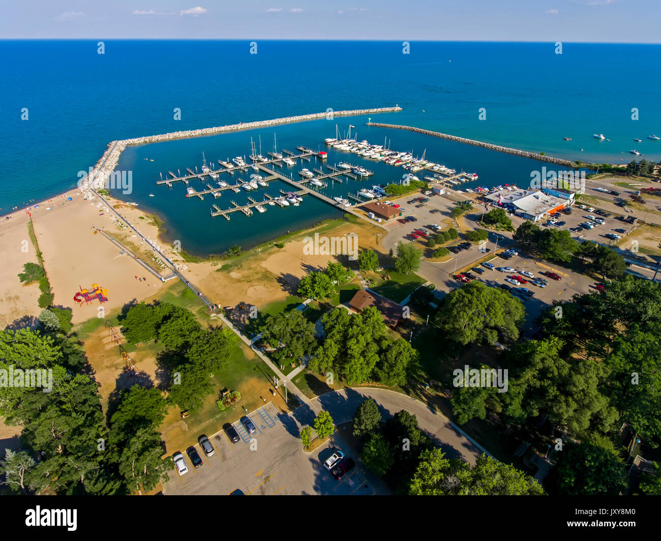 Aerial view of Lexington Michigan on Lake Huron showing a man made harbor and how it protects a marina from wind and waves Stock Photo