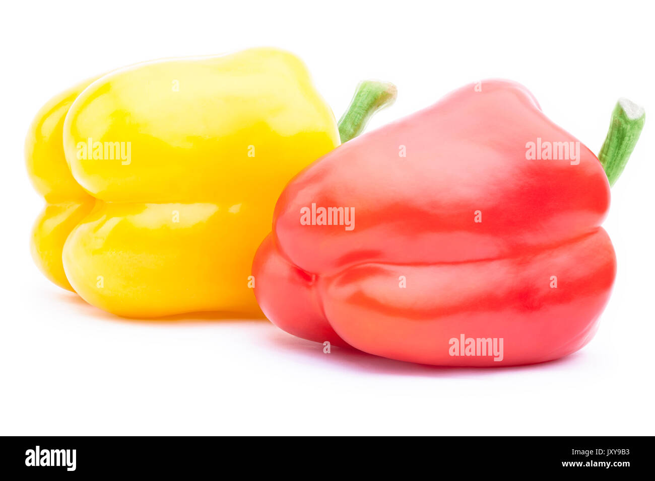 Red and yellow bell peppers isolated Stock Photo - Alamy