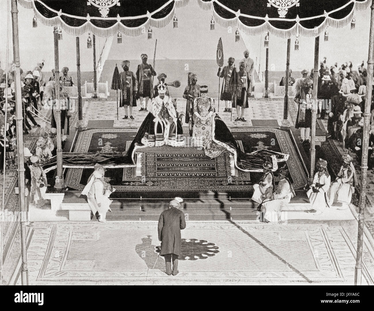 The Nizam of Haidarabad pays homage to King George V and Queen Mary at the 1911 Delhi Durbar, Coronation Park, India. George V, 1865 – 1936.  King of the United Kingdom and the British Dominions, and Emperor of India. Mary of Teck, 1867 – 1953. Queen of the United Kingdom and the British Dominions and Empress of India. From Hutchinson's History of the Nations, published 1915. Stock Photo