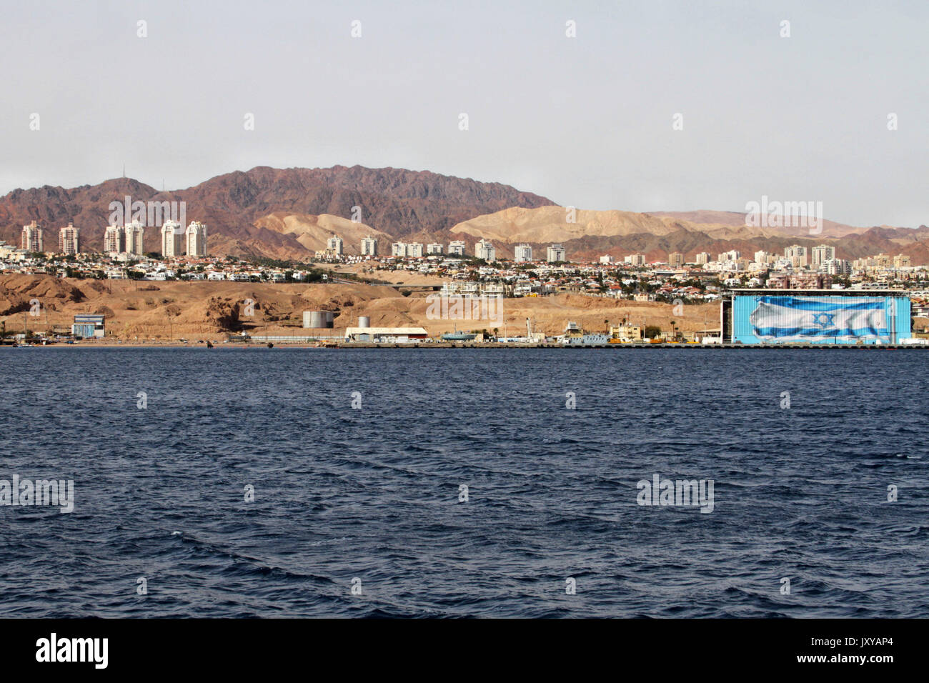 The world's longest Israeli flag mural is seen in Eilat from a boat on the Red Sea. Stock Photo