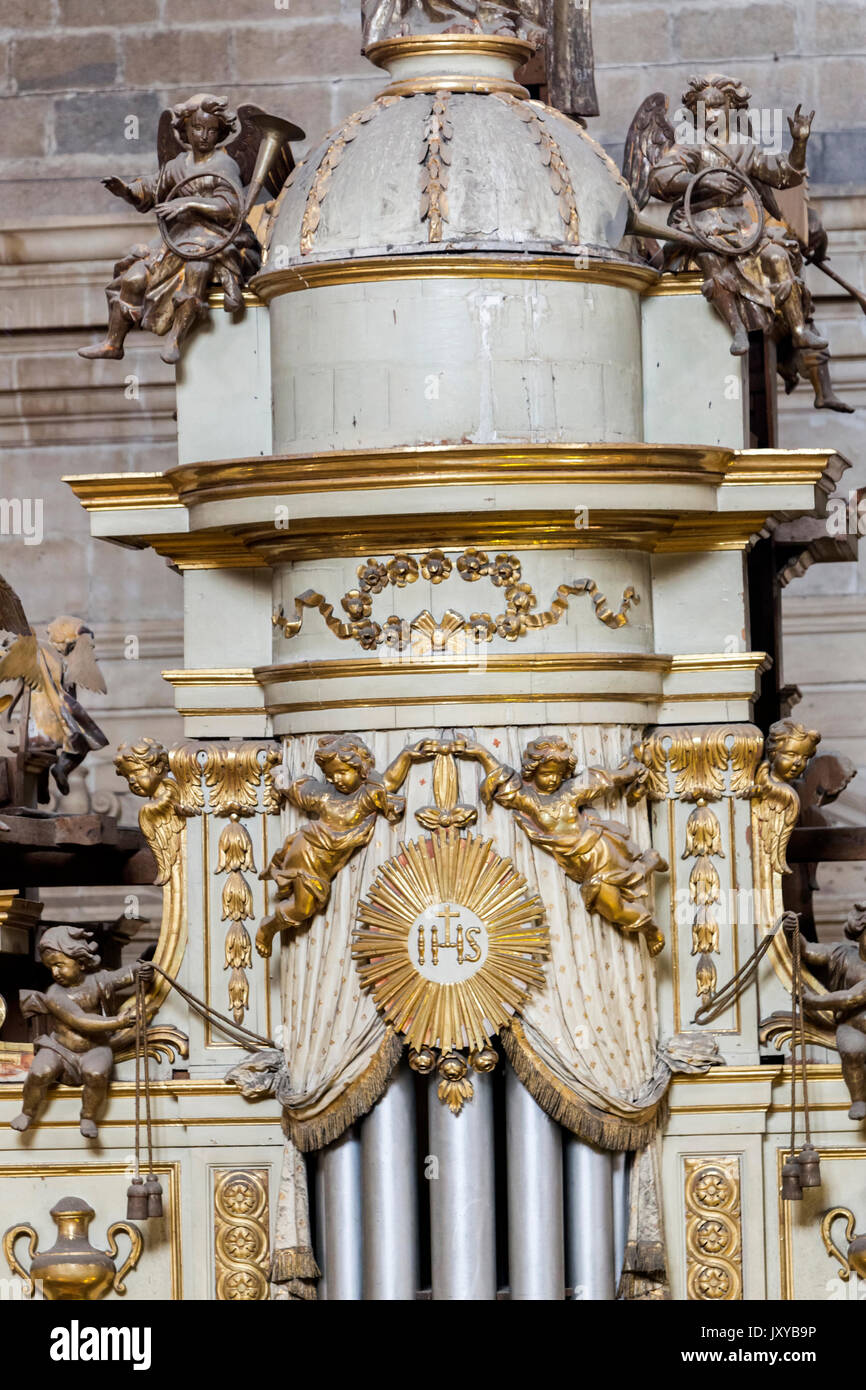 Jaen, Spain - may 2016, 2: Detail of the top turret of the box of the organ with the musical angels, is on the choir in the side of the Epistle of the Stock Photo