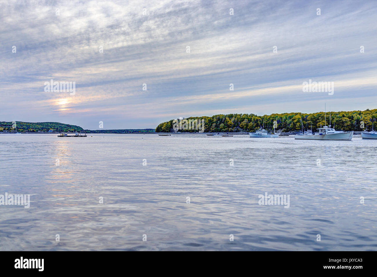 Bar Harbor, USA June 8, 2017 Sunset sun path in Bar Harbor, Maine village with empty boats in