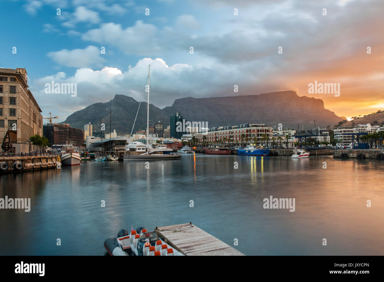 The Cape Town Waterfront and Table Mountain at dusk. Stock Photo