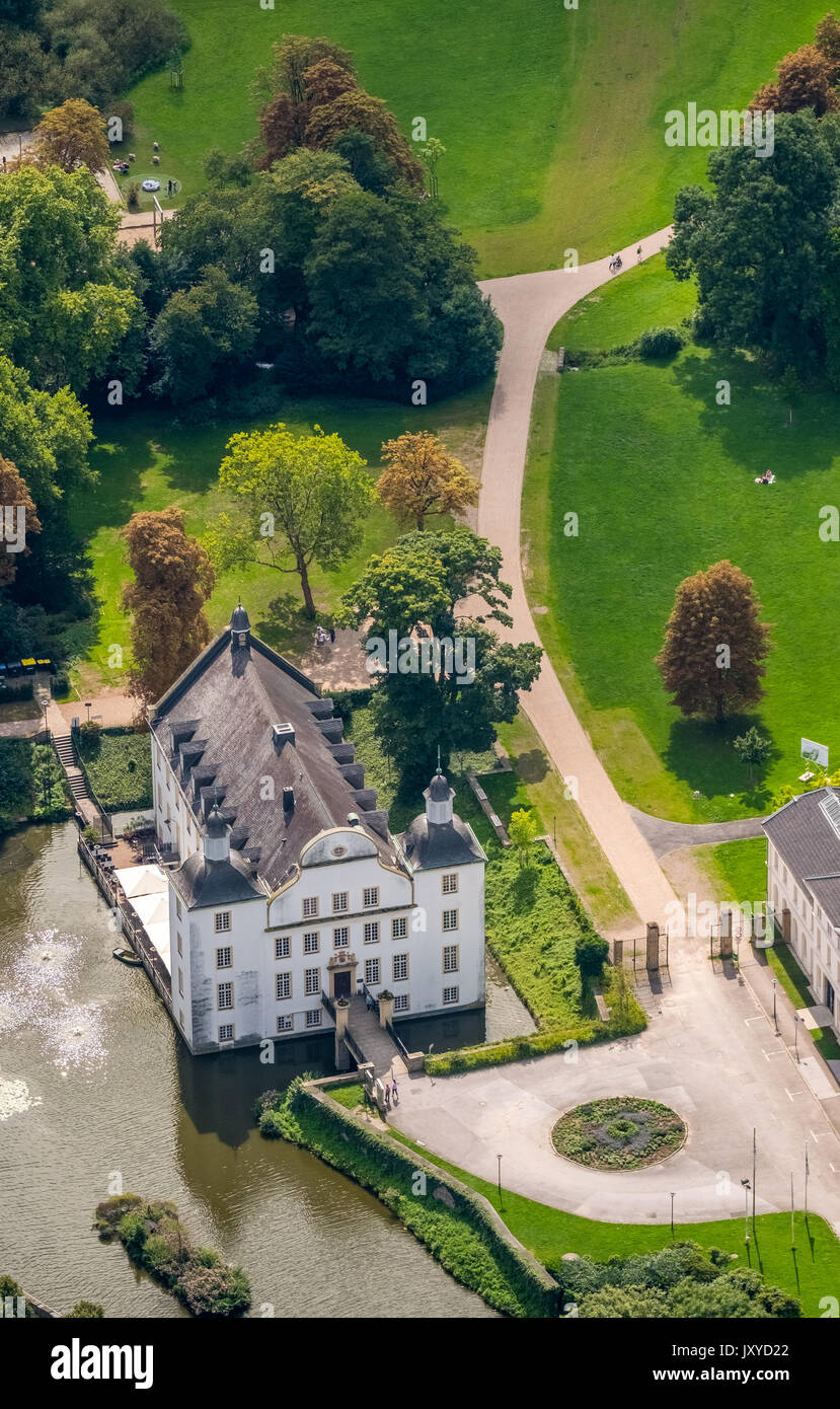 Schloss Borbeck, baroque moated castle, main house and an elongated farm buildings, curly gable, castle park is designed as an English landscape garde Stock Photo