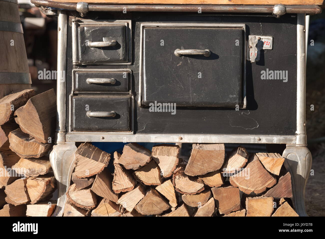 Retro Black Iron Stove with Firewood Front View Stock Photo