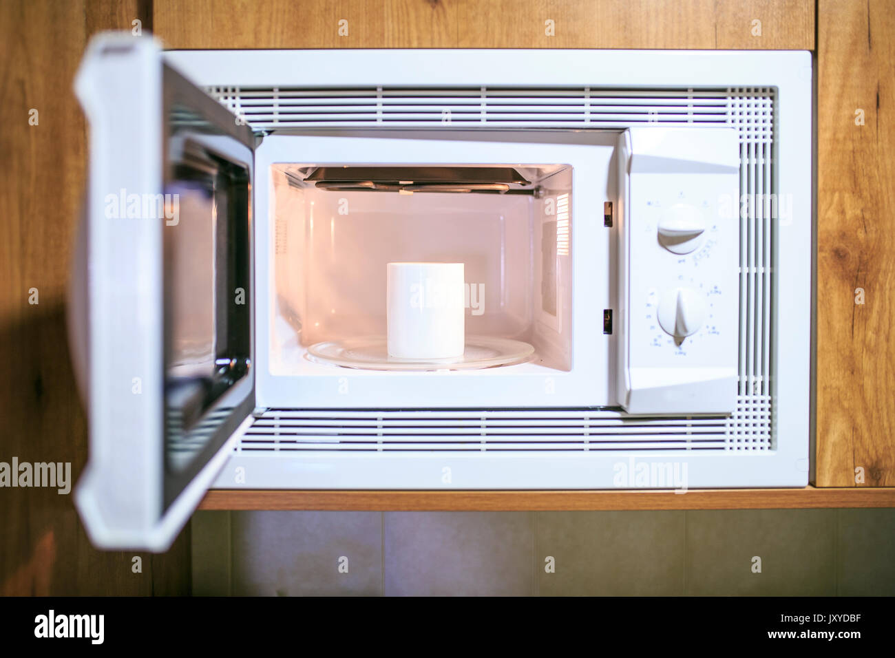 Cup of coffee in a microwave Stock Photo Alamy