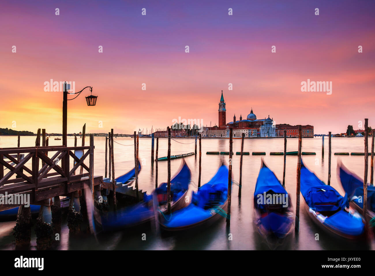 Vibrant dawn over the island of San Giorgio Maggiore seen from just off St. Mark's Square in Venice, Italy. Stock Photo