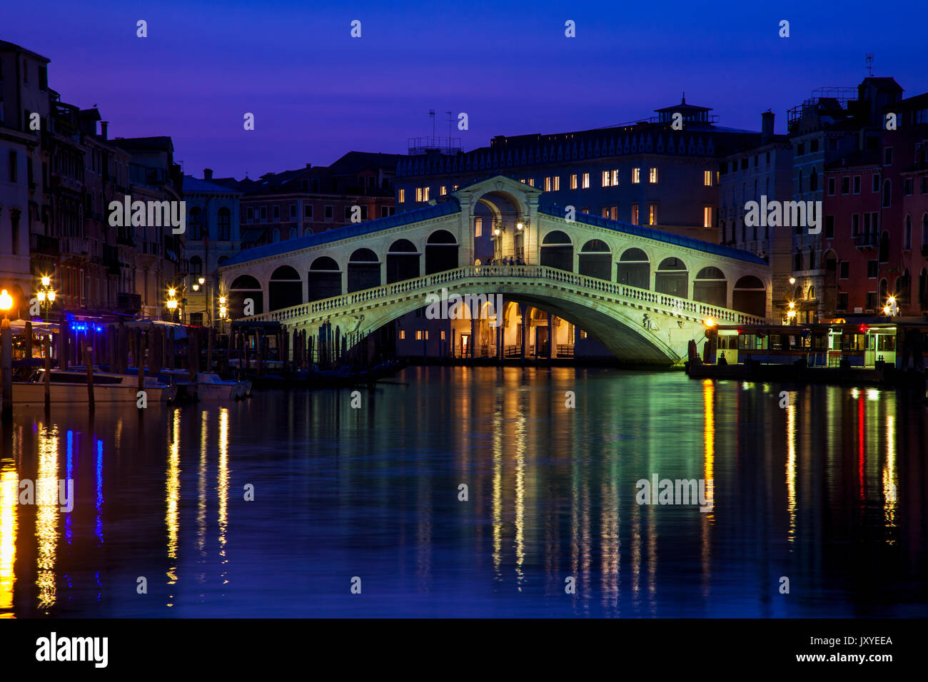 Twilight over the iconic Rialto Bridge spanning the Grand Canal in Venice, Italy. Stock Photo