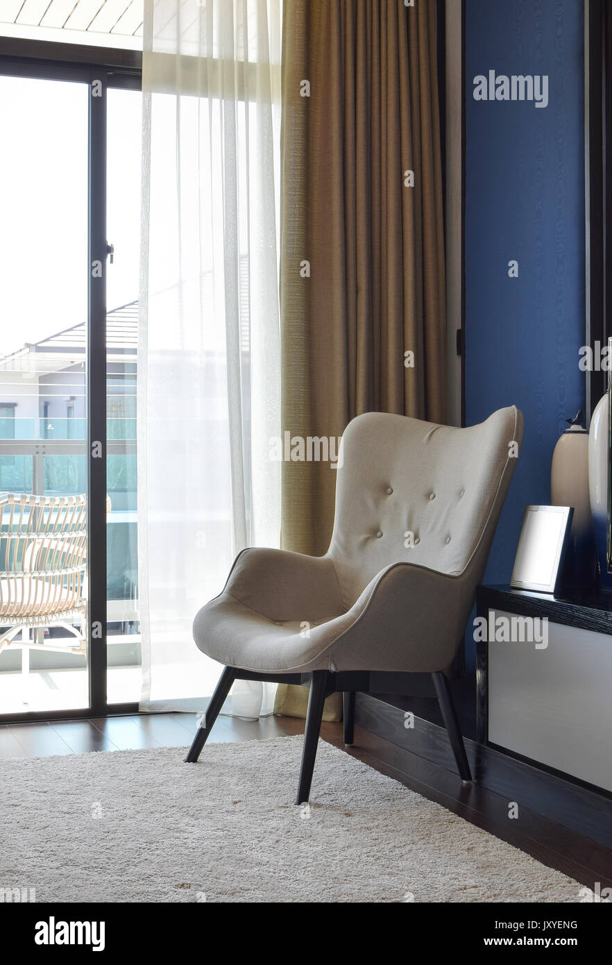 Comfortable Chair On Carpet In Modern Bedroom Interior Stock