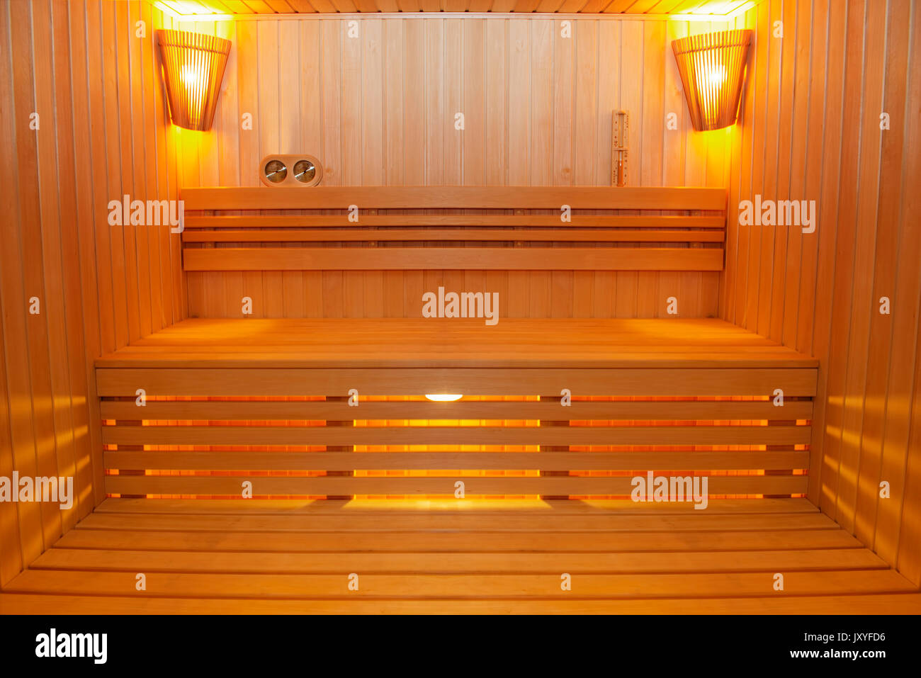 Sauna room with traditional sauna accessories Stock Photo