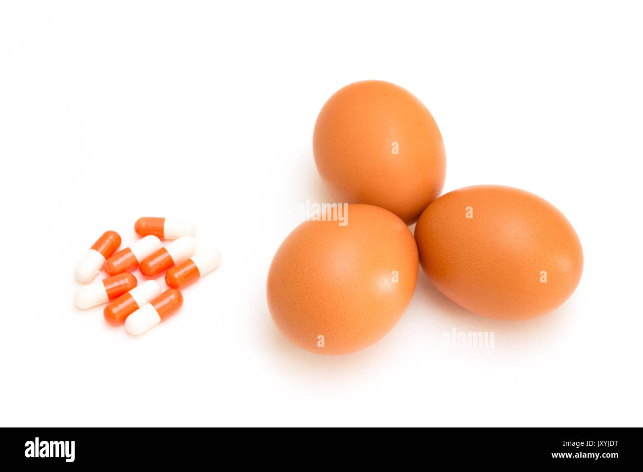 egg and pill isolated on white background Stock Photo
