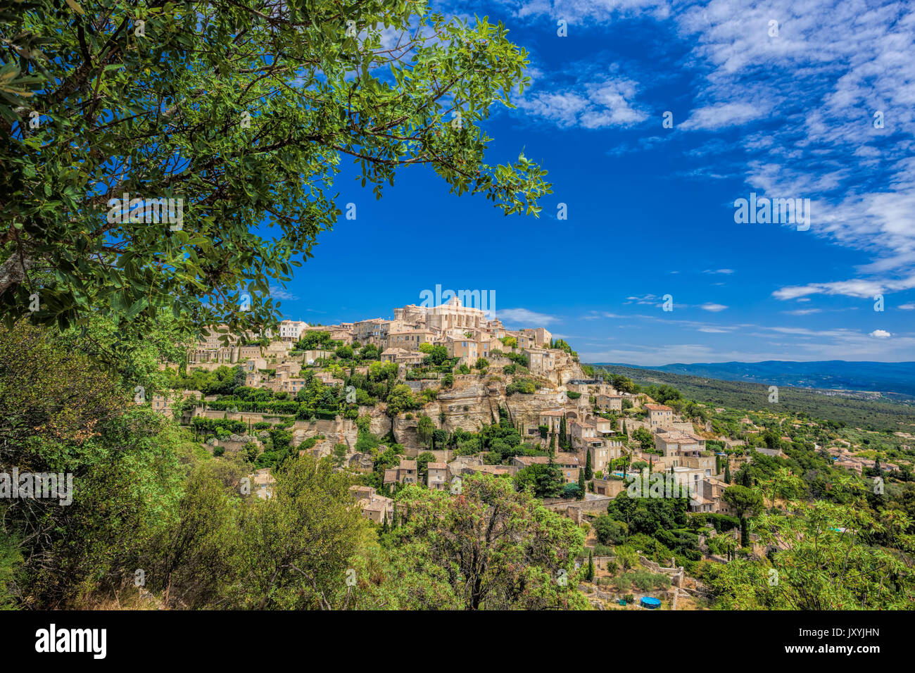 Famous old village Gordes in Provence against sunset in France Stock Photo