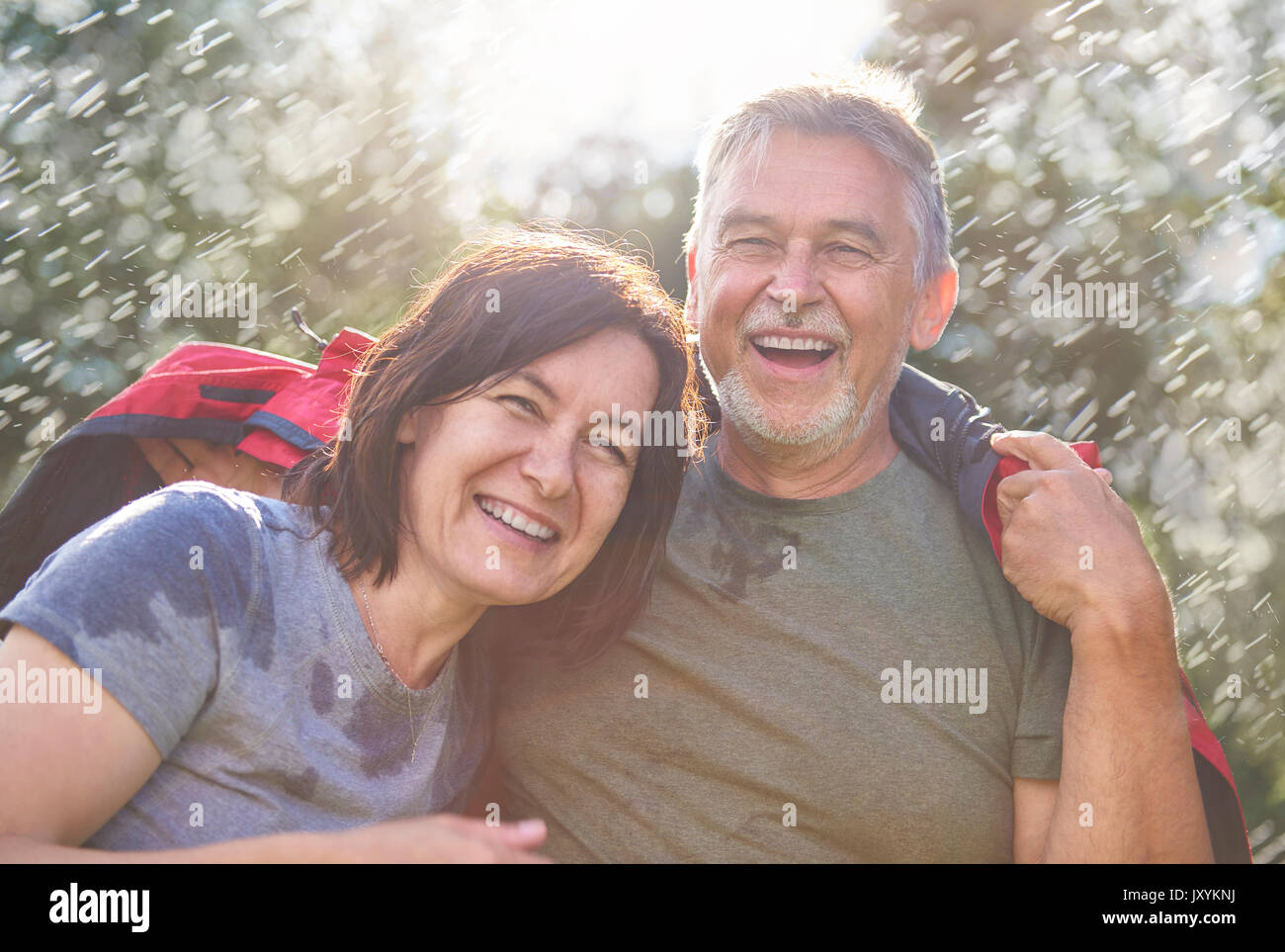 Senior couple laughing and hugging Stock Photo