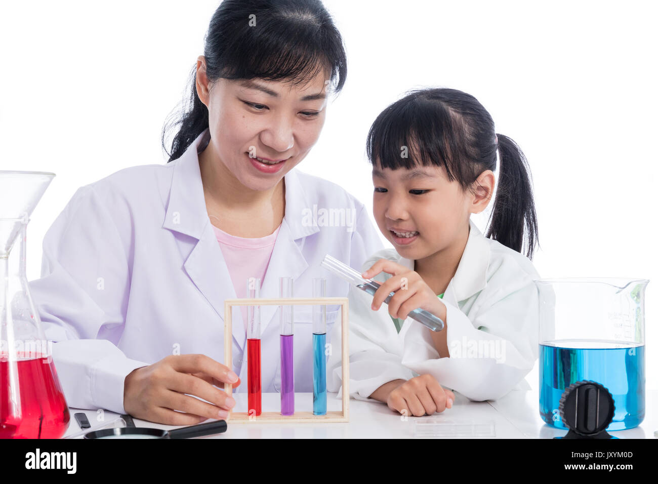 Asian Chinese teacher and little student girl working with test tube in  isolated white background Stock Photo - Alamy