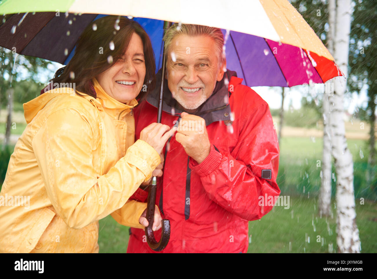 Man and woman under umbrella hi-res stock photography and images - Alamy