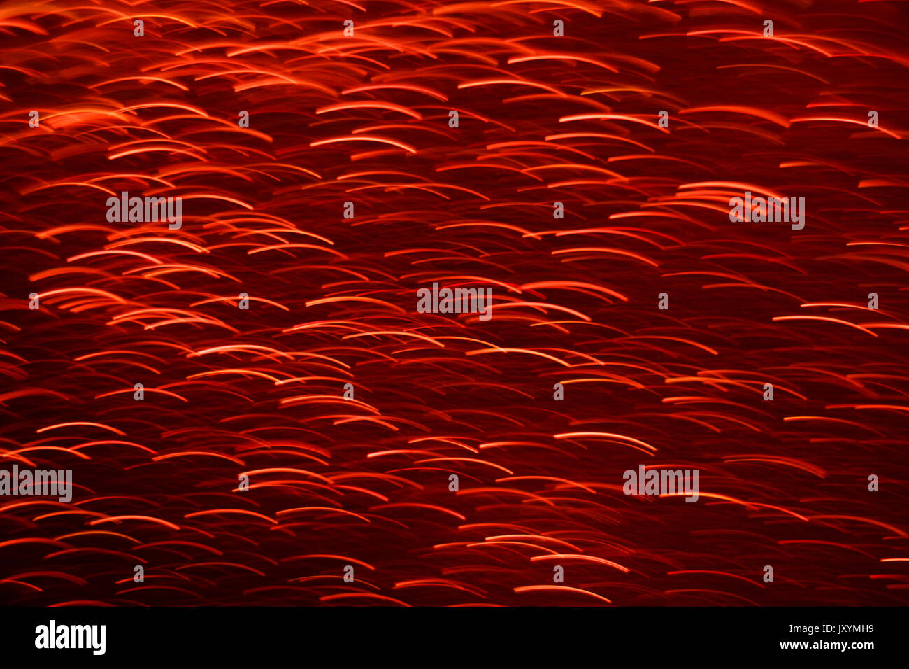 Defocused abstract red lights background with shimmering light Stock Photo